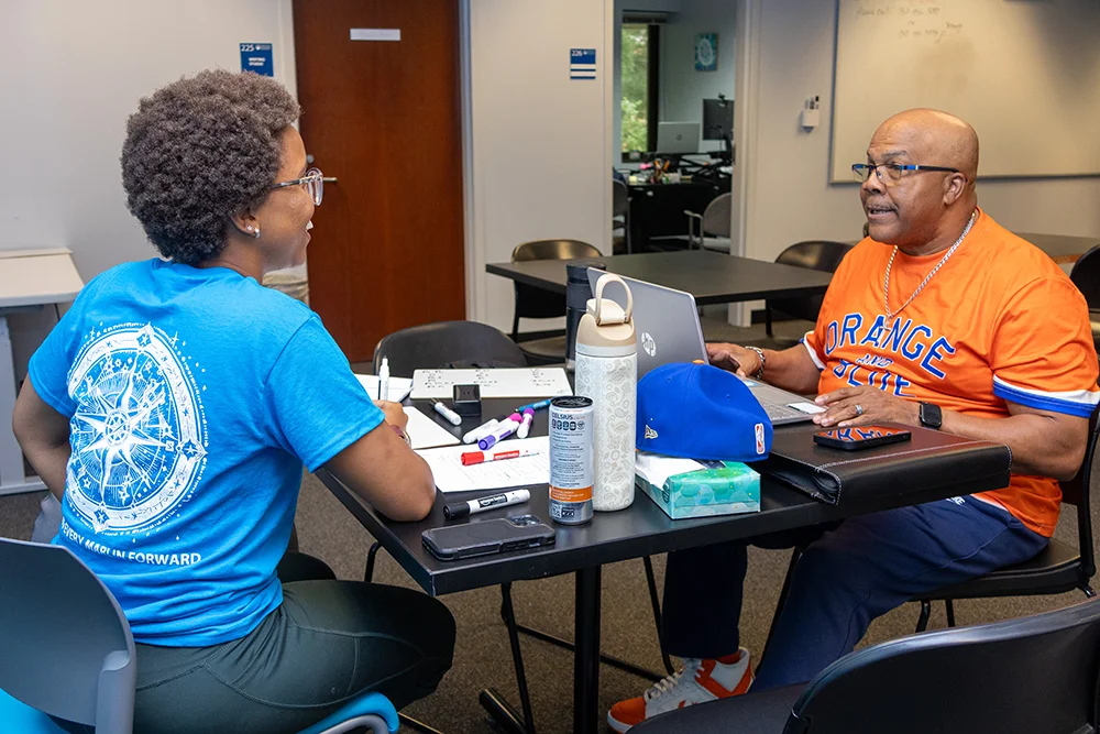Students working with a tutor in the Learning Center